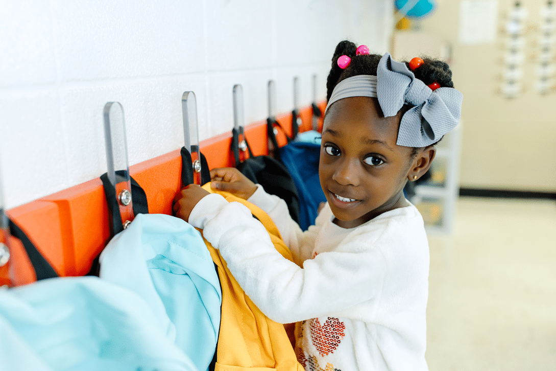HangSafe Racks with coats and backpacks mounted in a classroom